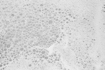 Poster - white soap foam on the surface of the water