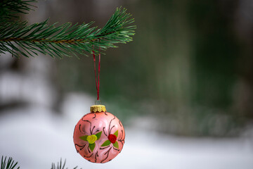 Poster - New Year's decoration hangs on a christmas tree in nature