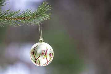 Poster - New Year's decoration hangs on a christmas tree in nature