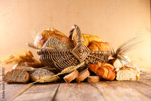 wicker basket with bread and pastry © M.studio