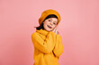 © Look! - Inspired child posing on pink background. Studio shot of short-haired preteen girl.