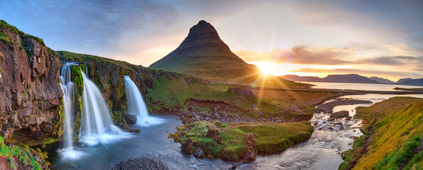 summer sunset on famous kirkjufellsfoss waterfall and kirkjufell mountain. colorful evening panorama