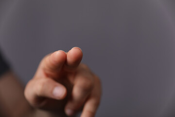 Poster - A man hand touching virtual screen, modern background concept , can put your text at the finger, copy space.