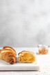 Minimal breakfast freshly baked croissant with passion fruit jam