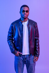 Wall Mural - Men's Fashion. Portrait Of Confident Handsome African Guy In Stylish Leather Jacket