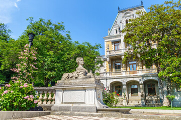 Wall Mural - Panorama of Massandra palace with its park and statue of sphinx with female head. Building founded in 1881. Shot near Yalta, Crimea