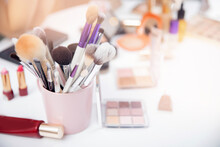 Closeup Cosmetic Kit Makeup Brushes In Pink Cup, Copyspace