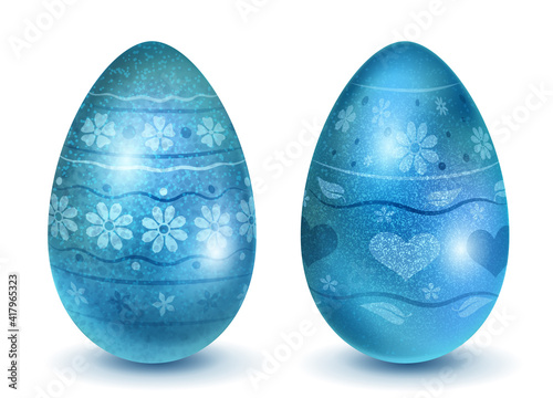 Two realistic Easter eggs with different surface texture, patterns and holiday symbols in light blue colors. With shadows on white background © Olga Moonlight