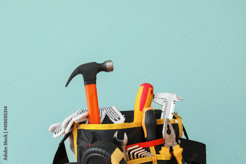 Set of construction tools on color background, closeup