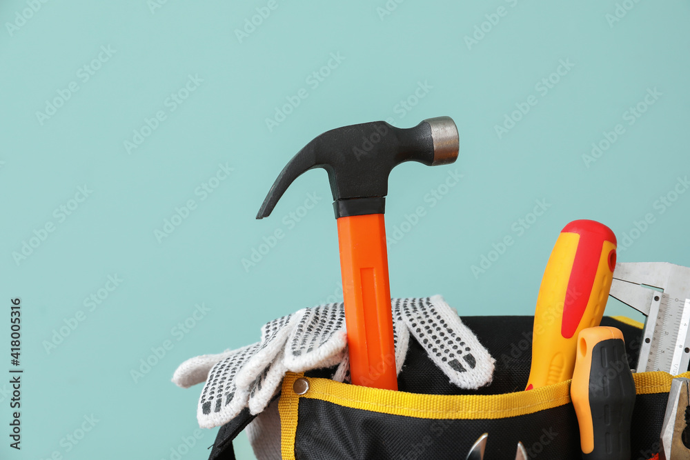 Set of construction tools on color background, closeup
