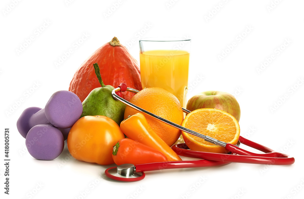 Healthy products, dumbbells and  stethoscope on white background