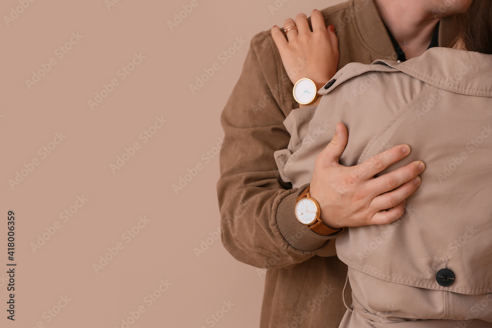 Happy young couple on color background