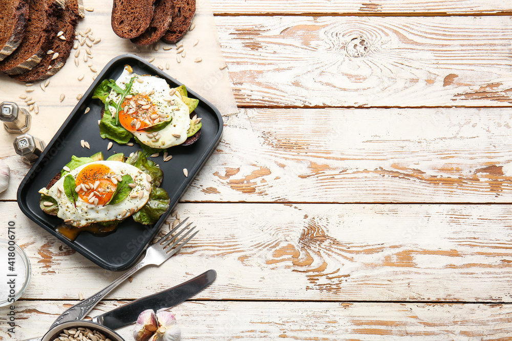 Tray with fresh tasty bruschettas on wooden background
