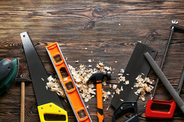 Wall Mural - Set of carpenter's tools and saw dust on wooden background