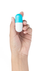 Sticker - Hand holding blue of Medicine capsule isolated on white background.