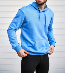 Wall Mural - bearded guy wears blue hoodie. no logo color hoodie. clothing line mock up