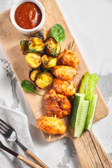 Poster - Chicken Thigh Kebabs With Roasted Potatoes. Grilled chicken skewer on white table. Restaurant rustic food concept.