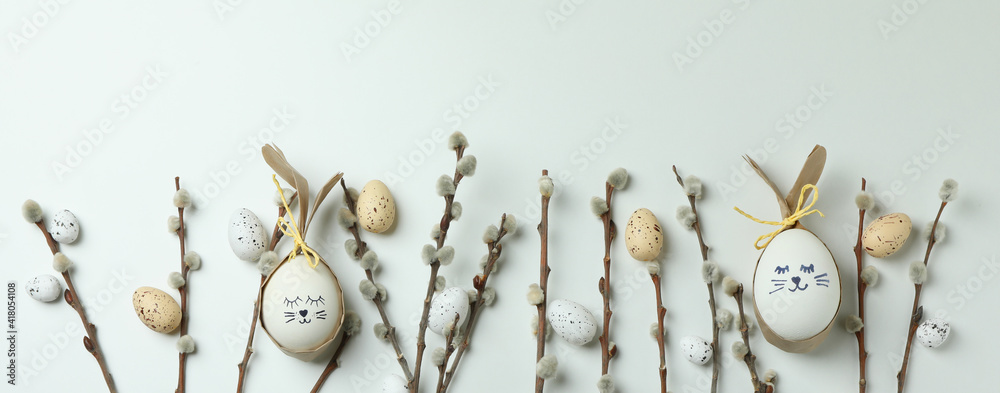 Easter eggs, quail eggs and catkins on white background - obrazy, fototapety, plakaty 