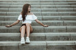 © RooM The Agency - Teenage girl sitting on steps, Spain