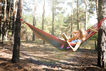 Sticker - Woman with book relaxing in hammock outdoors on summer day