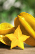 Delicious carambola fruits and slice on wooden table