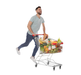 Sticker - Happy man with shopping cart full of groceries on white background