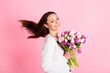 © deagreez - Profile side photo of charming sweet cute young woman hold flowers fly hair isolated on pastel pink color background