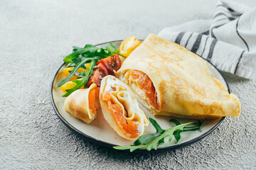 Wall Mural - Crepes with stuffed cream cheese and salmon. Lunch meal food concept.