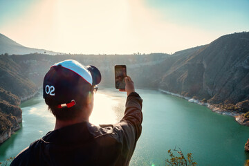 man of tourist taking a selfie in the atexcac lake.puebla mexico