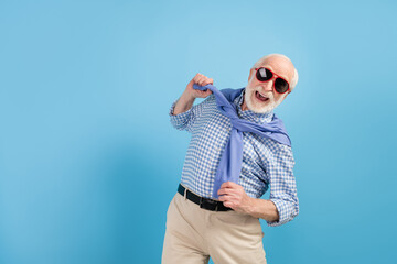 Poster - Photo of optimistic old grey hairdo man dance wear spectacles blue shirt isolated on color background