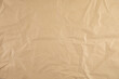 © ARAMYAN - brown crumpled paper texture background.