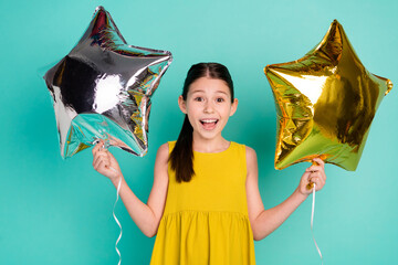 Sticker - Photo of optimistic nice brown hair girl hold balloons wear yellow dress isolated on bright teal color background