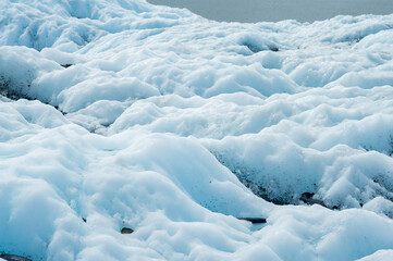 Blue and white glacier in cold beautiful Alaska