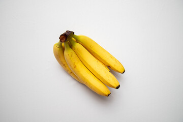 Wall Mural - Bunch of fresh ripe bananas on a white background