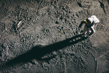 high angle shot of an astronaut miniature toy on the moon