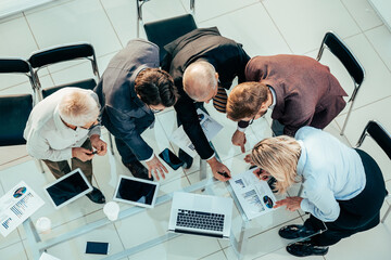 Wall Mural - top view. group of employees analyzing financial performance .