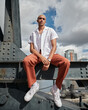 © Avel - man sitting on a crane