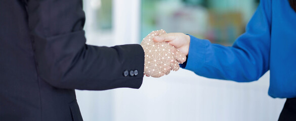 Wall Mural - close up on businesswoman hand shaking with robotic AI hologram to confirm and dealing for business and technology innovation of RPA concept	