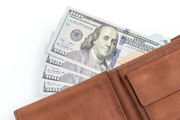 Wall Mural - Close up of hundred dollar bills in the wallet on white background