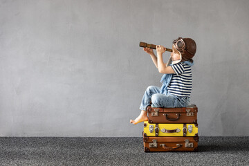 happy child dreaming about summer vacation and travel