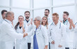 © ASDF - happy medical colleagues shaking hands with each other.