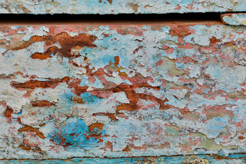 Old wooden fishing boat out of water, detail of paint. Crescent City, California.