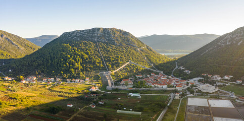 Wall Mural - Aerial panorama drone shot of Ston with Salt Pan in Ragusa near Dubrovnik in Croatia Summer morning sunrise