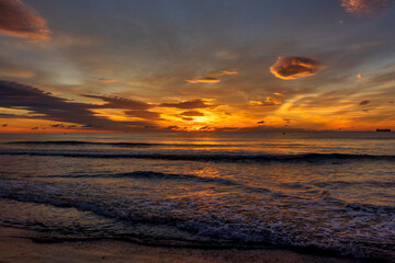 Sticker - A beautiful sunrise from the shore of the beach