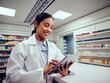 © StratfordProductions - Cheerful woman working in chemist using touchscreen digital tablet
