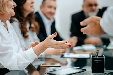 Wall Mural - business partners discuss issues sitting at the negotiating table.