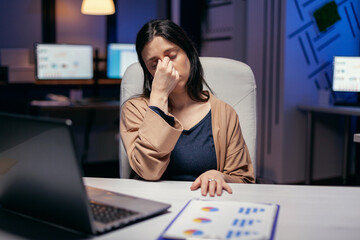 Poster - Businesswoman having a migraine in the course of overtime hours for job to work in deadline. Employee falling asleep while working late at night alone in the office for important company project.