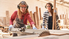 Women As Carpenter Apprentices At The Circular Saw