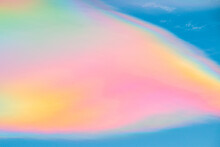Multicolored Rainbow Cloud In Natural Sky Background. Unusual And Beautiful Meteorological Atmospheric Phenomenon Called Irisation Or Iridescent. Circumhorizontal Arc Or Rainbow Of Fire Cirrus Clouds.