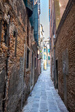 Fototapeta Uliczki - Old historic buildings along a narrow street. Venice, Italy